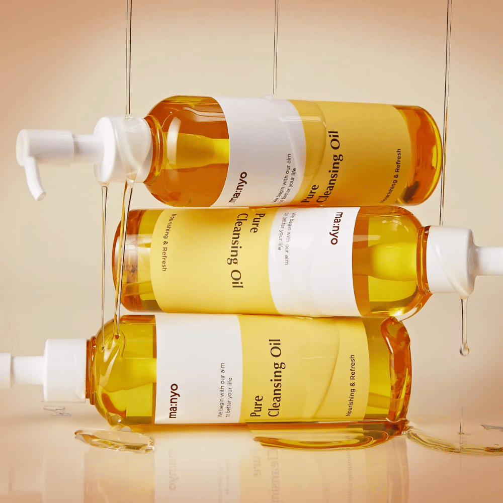 Three bottles ma:nyo Pure Cleansing Oil 200ml stacked for skincare and makeup removal.